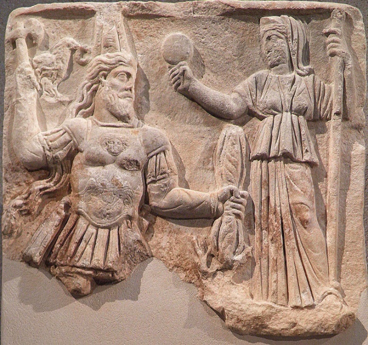 C:\Users\sherwin\Pictures\Jupiter Dolichenus and Juno, Armenian tiara, sword, an ax and lightning bundle, Juno has a mirror and a scepter, 3rd century.jpg