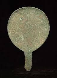 P:\pix\projects\human evolution\mirror\MESOPOTAMIAN BRONZE MAGNIFYING MIRROR, ca. 2nd millennium BC.jpg