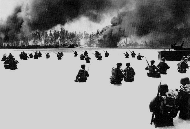 U.S. troops of the 2d Battalion, 165th Infantry, struggle to shore on Yellow Beach on Butaritari (Makin) Island following a naval gunfire bombardment