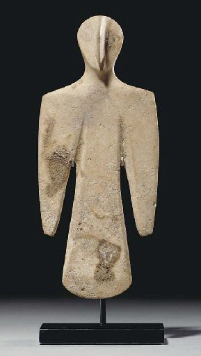 A BACTRIAN WHITE STONE IDOL CIRCA 3RD MILLENNIUM B.C.