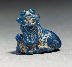 A SUMERIAN LAPIS LAZULI AMULET OF A BULL - EARLY DYNASTIC III PERIOD, 2650-2350 B.C. - The reclining bull with bearded human head, curved horns, pierced twice vertically, Â½ in. (1.5 cm.) high