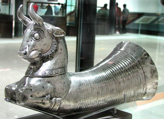 A very invaluable and rare Siver Rhyton of a seated bull, Jaam-e Jahaan Namaa exhibition, Bonyad museum, from a collection of Shah's courtieres and generals' properties that were put into requisition following the revolution of 1979. Silver rhytons such as this were ubiquitous and used as a drinking vessel in ancient Persia, especially during the reign of the Achaemenids. It is persumed that this specific vessels were used fro drinking wine and other beverages in the ceremonies. Rezza Abbassi m