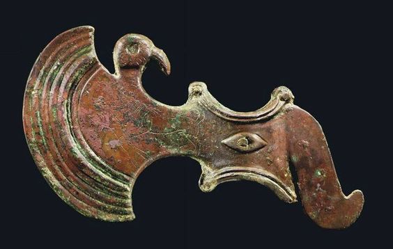 AN ELAMITE BRONZE AXE-HEAD CIRCA LATE 3RD - EARLY 2ND MILLENNIUM B.C.