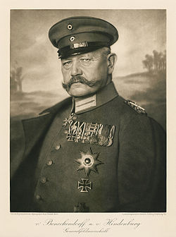 An old photograph of a man with a moustache in military uniform.