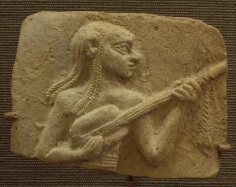 Below is a carving of an early Mesopotamian lute player, as preserved in the Oriental Museum in Chicago