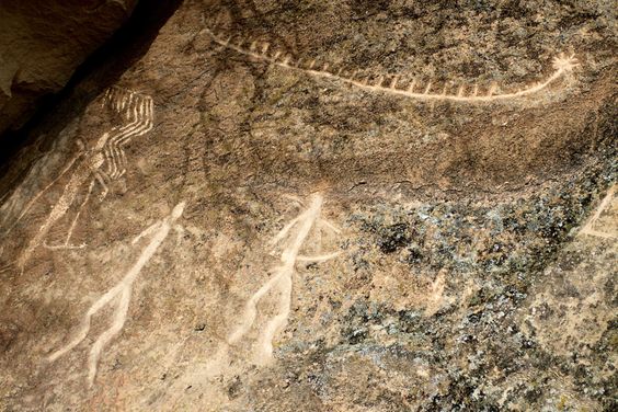 Dancing to millennia of desert winds. Neolithic rock art at Gobustan National Park, Azerbaijan. The upper glyph may represent a Stone Age ship. Photograph by Paul Salopek