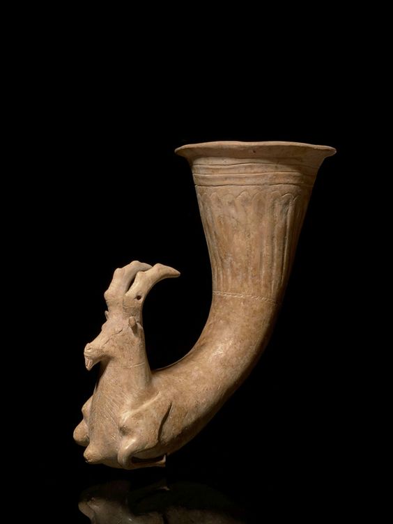 G:\pix\projects\iranzamin\achaemedian\جام\-400 Achaemenid terracotta rhyton in the form of an ibex, circa 4th century B.C..jpg