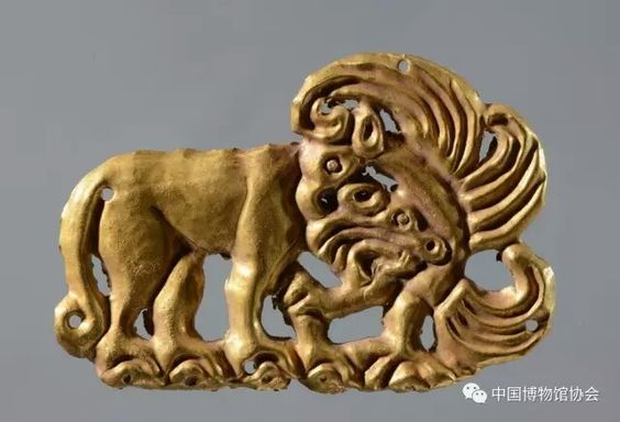 G:\pix\projects\iranzamin\achaemedian\Art\Gold plaque with animal combat motif, Warring States period, being exhibited at The Road of Bronze Exhibition at Xinjiang Museum, China.jpg