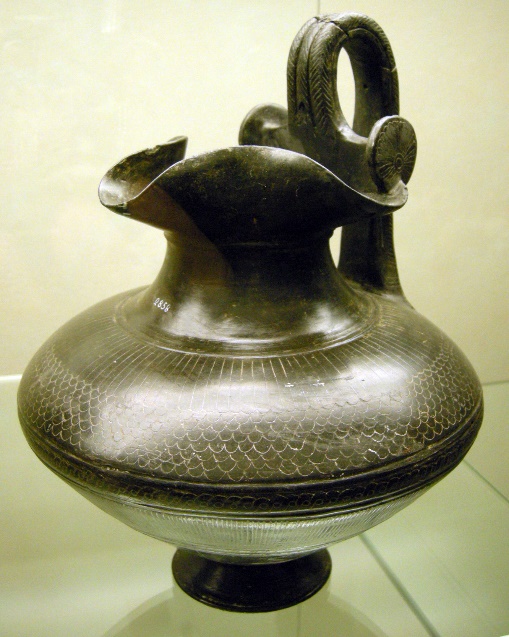 https://upload.wikimedia.org/wikipedia/commons/7/7e/Oinochoe_in_bucchero_etruria_meridionale%2C_fine_VII%2C_inizio_VI_secolo_ac..jpg