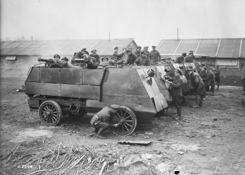 https://upload.wikimedia.org/wikipedia/commons/8/88/Cleaning_armoured_cars%2C_Canadian_Motor_Machine_Gun_Brigade_April_1918_LAC_3395367.jpg