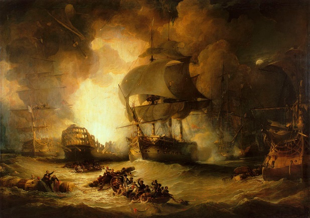 On a choppy sea, a large warship burns out of control. The central ship is flanked by two other largely undamaged ships. In the foreground two small boats full of men row between floating wreckage to which men are clinging.