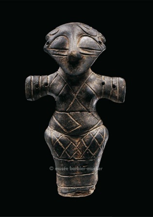 Vinca Female Statuette • Serbia locality of Vinca • Vinca culture • 4500-4000 BC • Clay. right arm partially restored • H. 15 cm The locality of Vinca (which extends from the former Yugoslavia to Romania) delivered a very large amount of female...