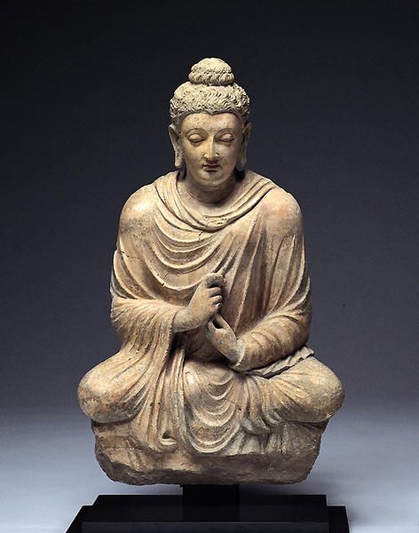 Seated Buddha with Dharmachakra Mudra (turning the wheel of Dharma). Hadda or Taxila, 4th-5th centuries.