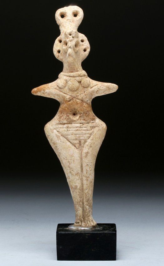 Syro Hittite clay figurine, 2750-1900 B.C. With arms extending outward, a bird like eyes, wear beaded necklace and elaborate crown, 14.9 cm high. Private collection